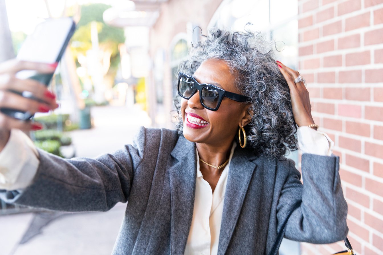 Black Woman Taking Selfie after Work